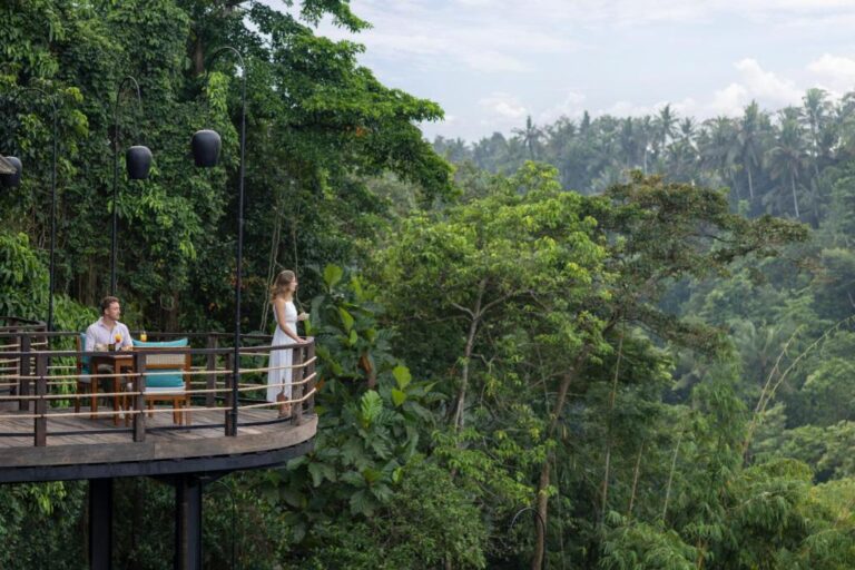 A couple on the viewing platform above the forest, The Kayon Valley Resort Ubud