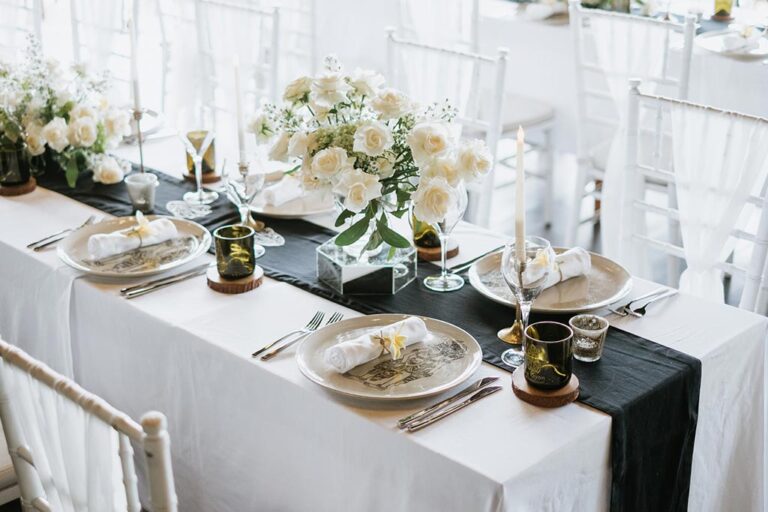 Place setting with white roses on the chapel table, The Kayon Valley Resort Ubud