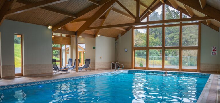 The Kingfisher Spa indoor pool under timber beams, The Lake Country House Hotel & Spa