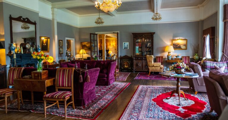 The grand drawing room, chandelier and Persian rugs, The Lake Country House Hotel & Spa