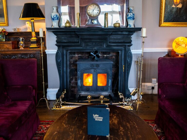 A lounge with a lit log burner, The Lake Country House Hotel & Spa
