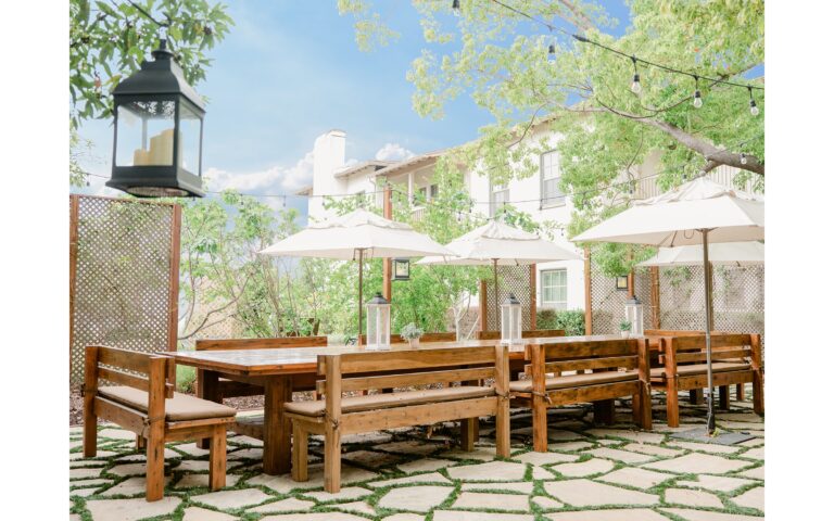 The Wentworth Garden terrace with long wooden tables, The Langham Huntington Pasadena