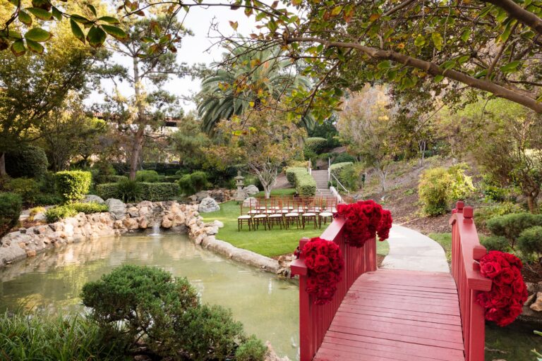 A reception laid out beside the Japanese Garden pond and red bridge, The Langham Huntington Pasadena