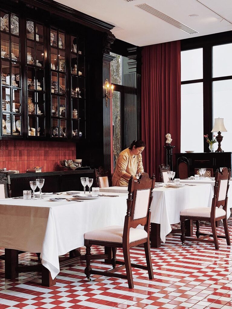 The Drawing Room dining room with a red and white tiled floor, The Library