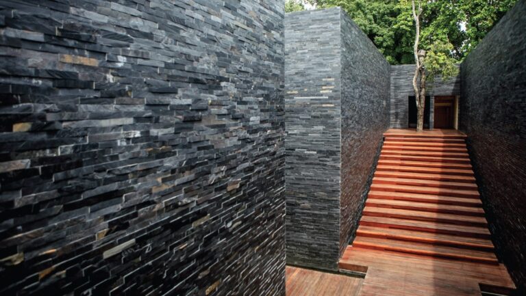 Slate walls and timber steps in the villa grounds, The Library