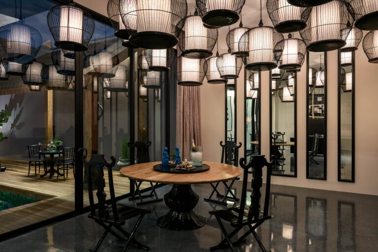 Lantern-hung dining room beside the pool at The Editor, The Library