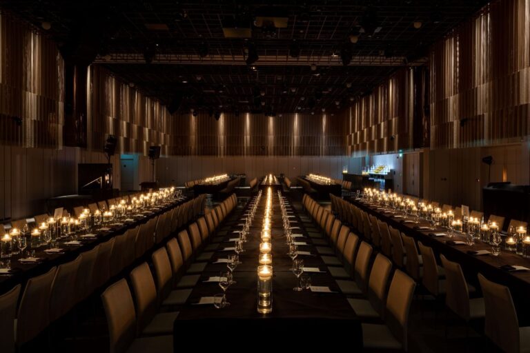 Long banquet tables down the length of the Ballroom, lined with candles, The Londoner