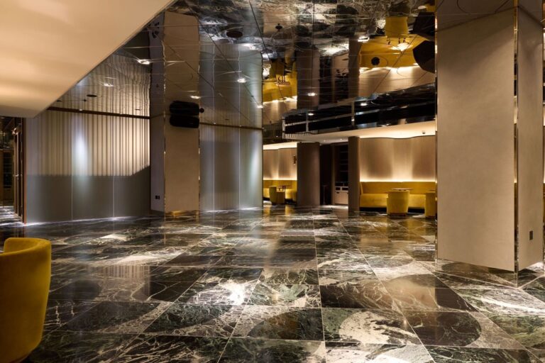 The open floor of the Green Room under its mirrored ceiling, used as a dance floor, The Londoner