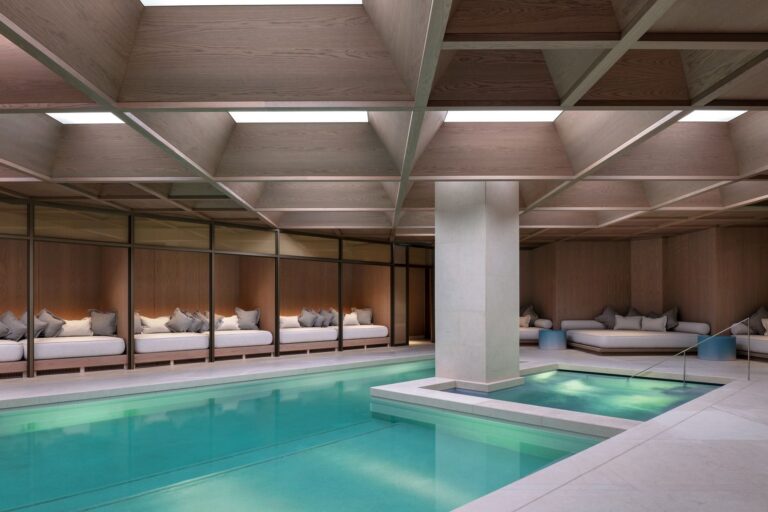 The pool and hydropool at The Retreat, with cabanas along the side, The Londoner