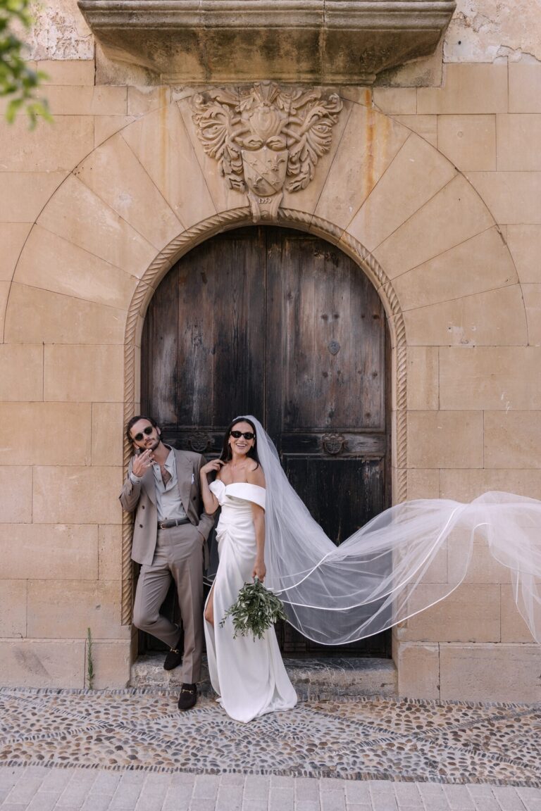 Arrival, the veil catching the breeze, The Mallorca Wedding Company