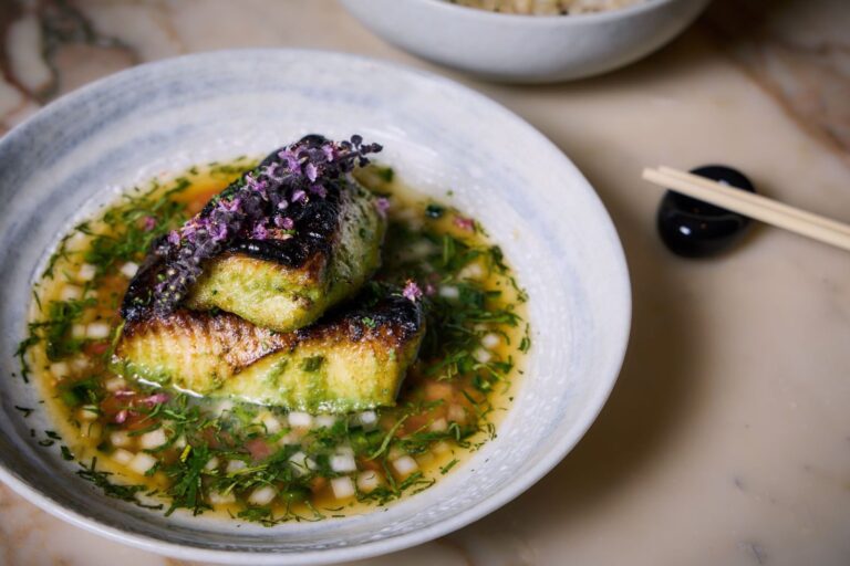 Black cod in a herb broth topped with purple shiso at May Fair Kitchen, The May Fair