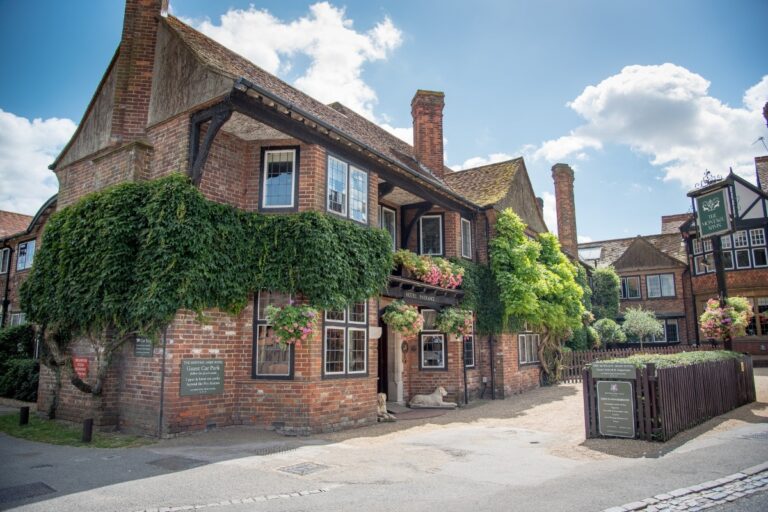 The Montagu Arms from Beaulieu village street, creeper over brick and tile, The Montagu Arms Hotel
