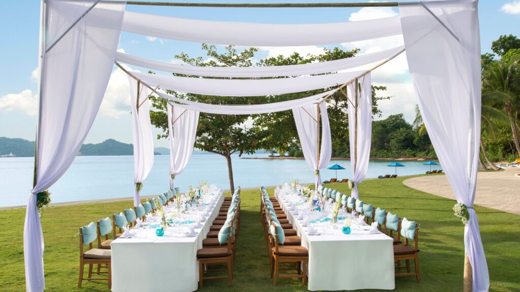 Lawn event table set up facing the sea, The Naka Island, A Luxury Collection Resort and Spa, Phuket