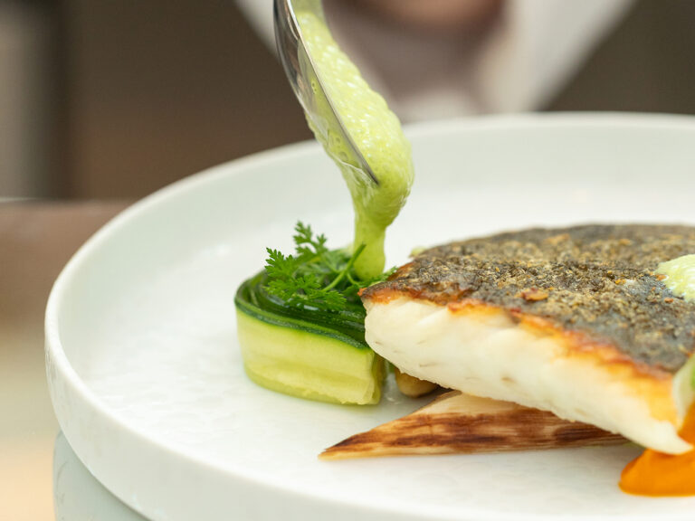 A fish course plated at La Cúpula, The Palace, a Luxury Collection Hotel, Madrid