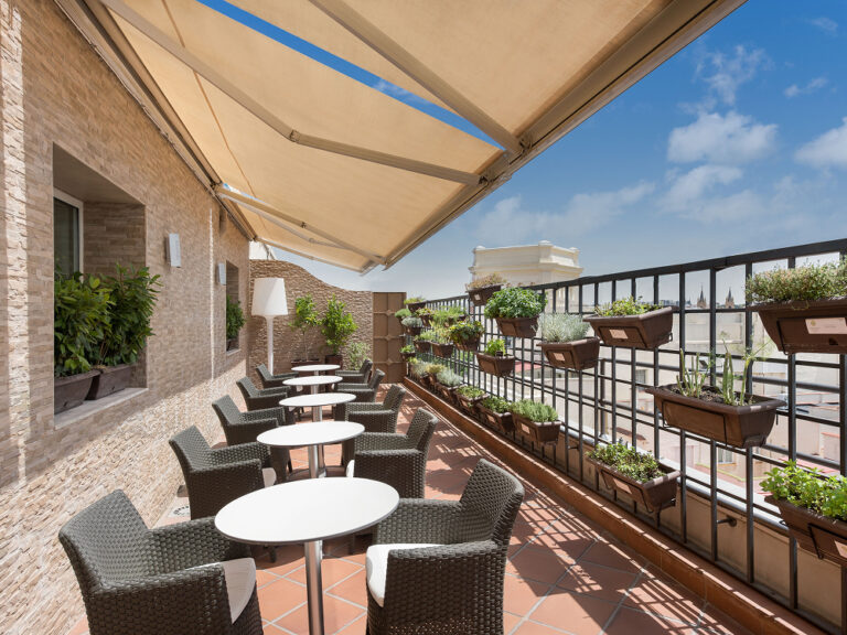 A terrace with café tables, The Palace, a Luxury Collection Hotel, Madrid