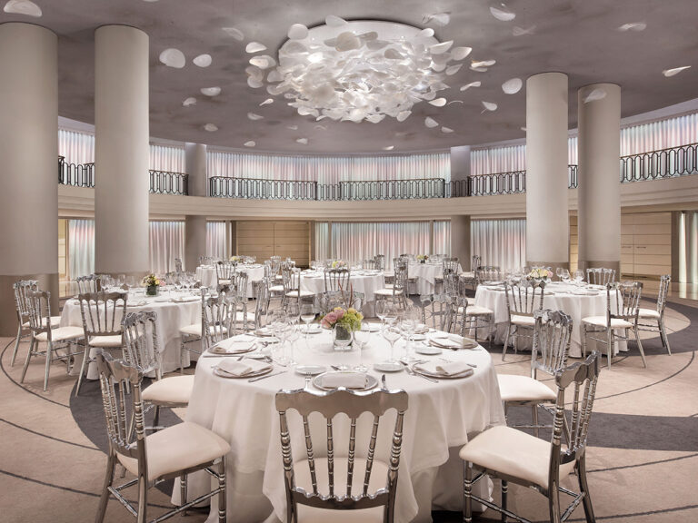 A ballroom laid with round tables and a petal chandelier, The Palace, a Luxury Collection Hotel, Madrid