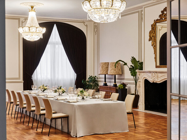 A salon with a long banquet table and a marble fireplace, The Palace, a Luxury Collection Hotel, Madrid