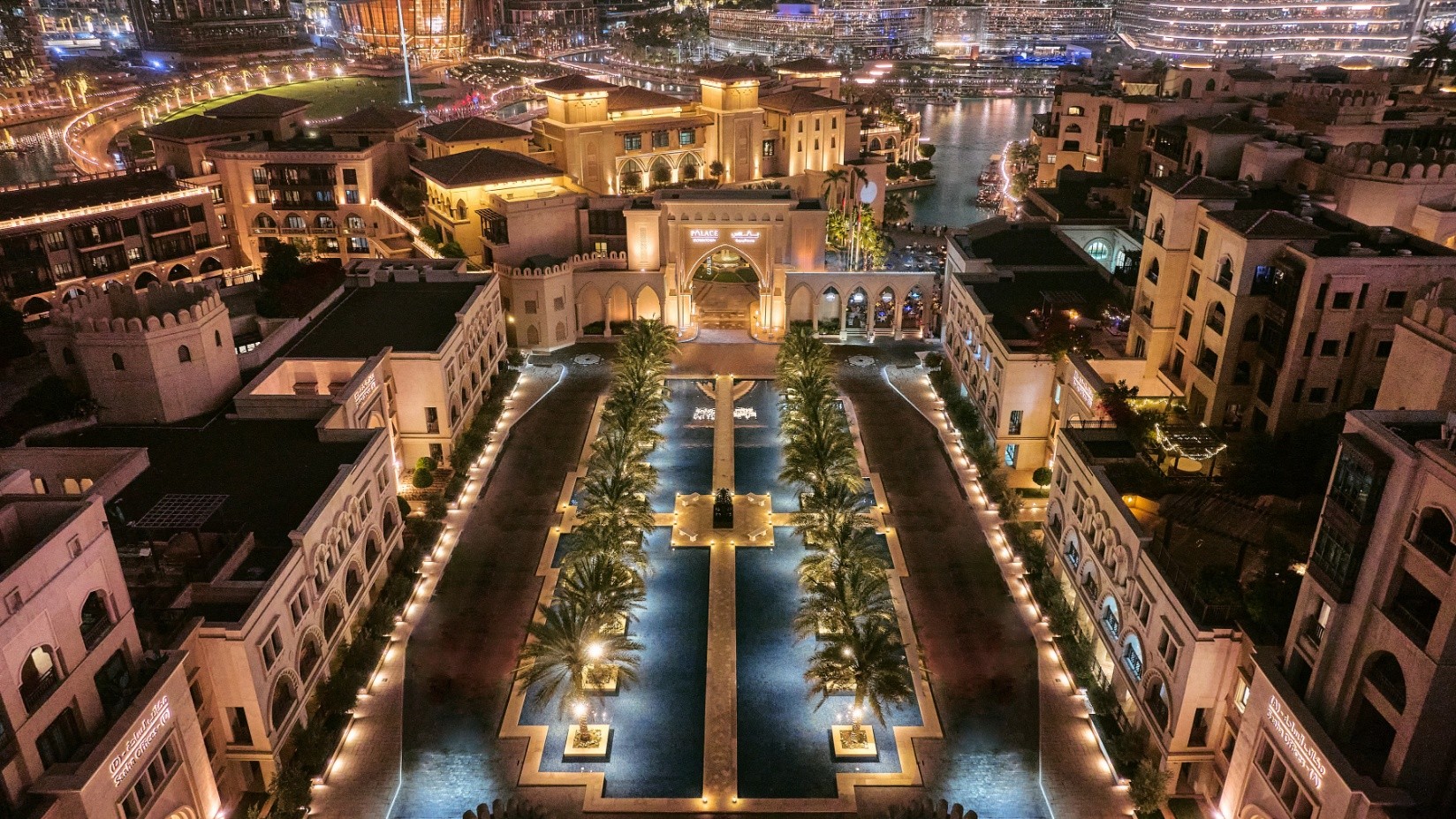 Aerial view of the hotel courtyards and pools at night, The Palace Downtown Dubai