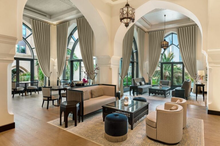 The Al Bayt lounge with arched windows and garden views, The Palace Downtown Dubai