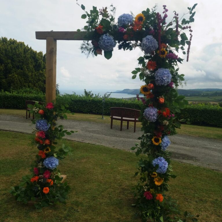 A floral arch on the lawn, The Penrallt Country House Hotel