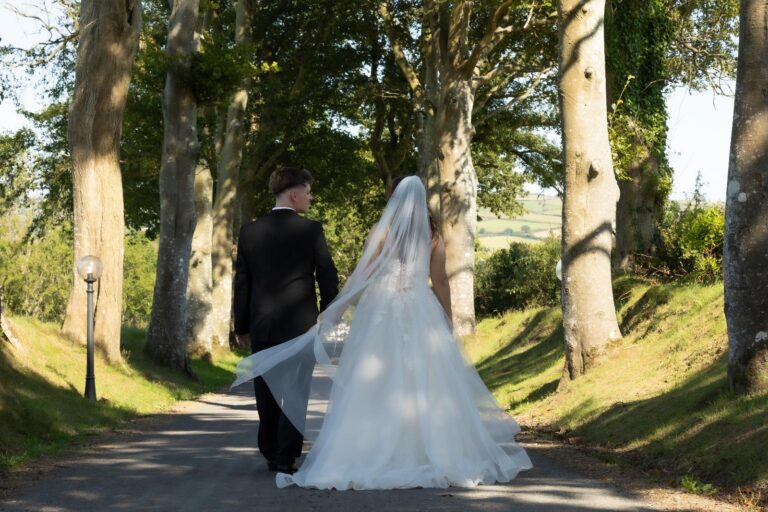 A couple on the tree-lined drive, The Penrallt Country House Hotel