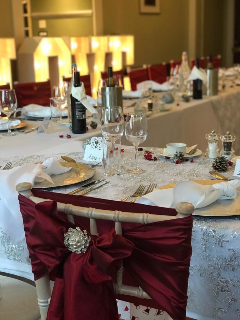 Table setting with chair sash at a Christmas wedding, The Penrallt Country House Hotel