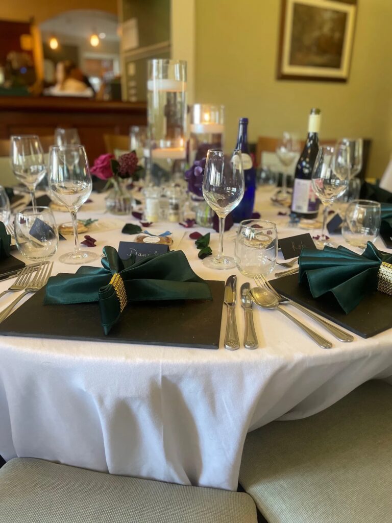 A round table laid for a wedding meal, The Penrallt Country House Hotel
