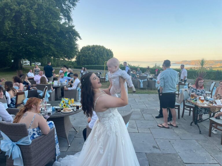 Wedding guests on the patio at sunset, The Penrallt Country House Hotel