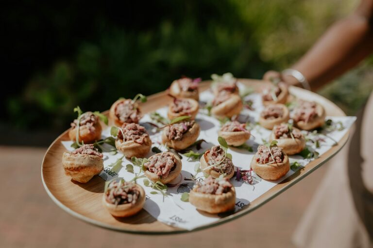 A tray of canapés carried out on the terrace, The Post Barn