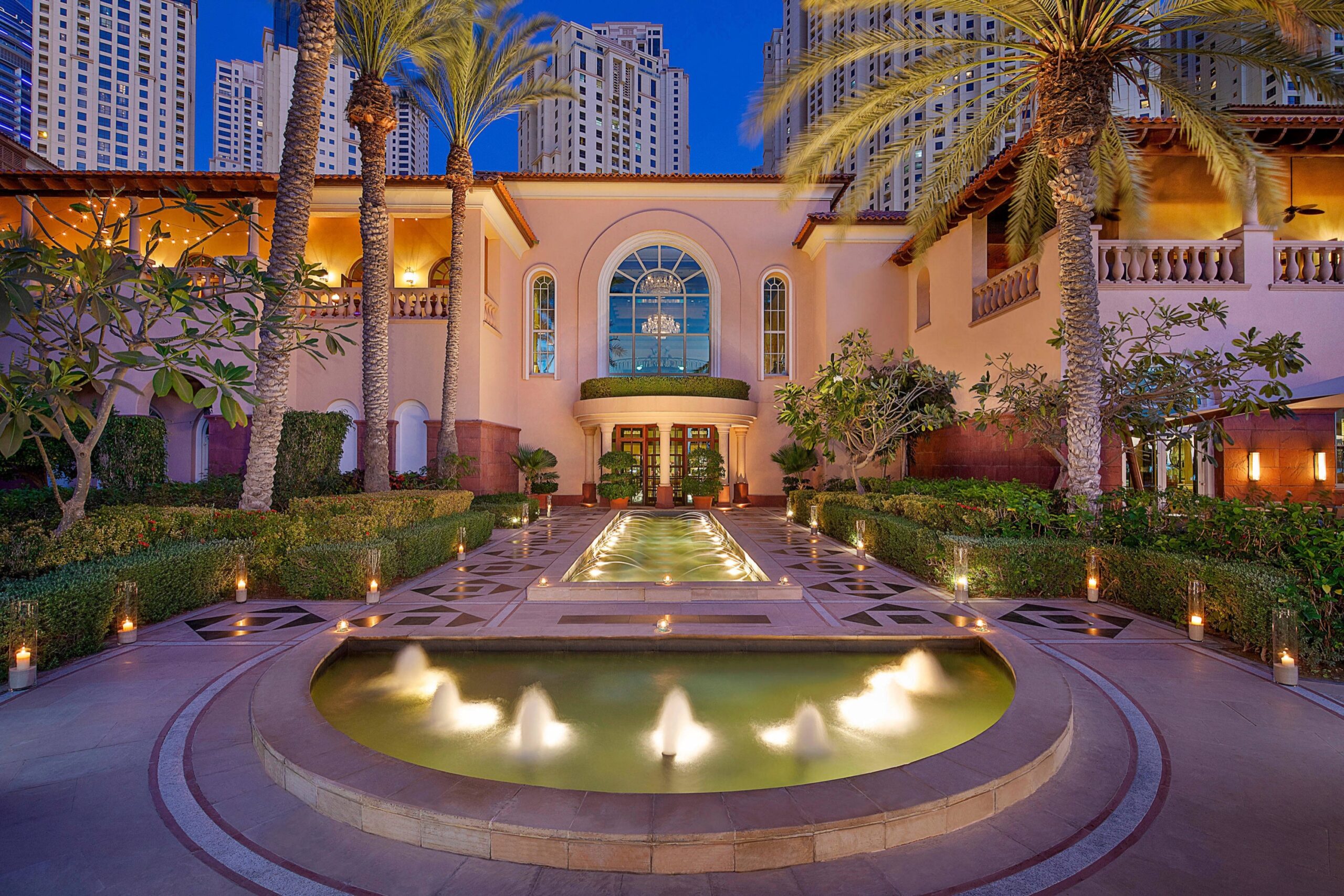 The illuminated fountain courtyard at dusk, The Ritz-Carlton, Dubai