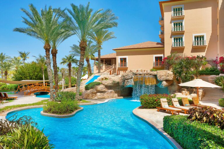 Lagoon pool with footbridge and waterfall, The Ritz-Carlton, Dubai
