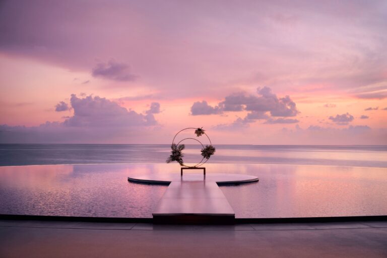 Ceremony arch on a deck over the water at sunset, The Ritz-Carlton Maldives, Fari Islands
