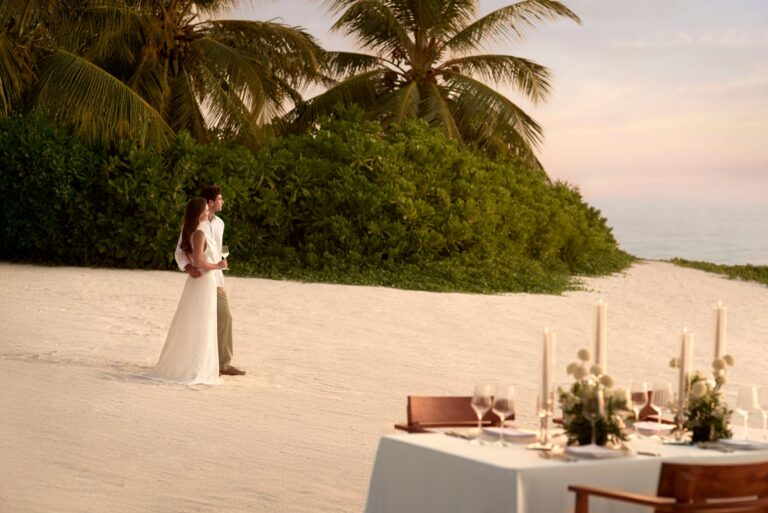 Table set on the sand at sunset, The Ritz-Carlton Maldives, Fari Islands