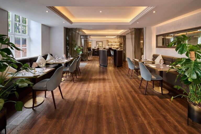 The Reading Room restaurant, a long room of banquettes and tables leading to the bar, The Roseate Reading