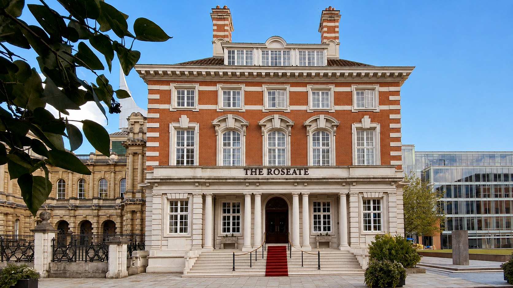 The red-brick and pale stone front of the former Shire Hall on The Forbury, with a red carpet laid up the entrance steps, The Roseate Reading