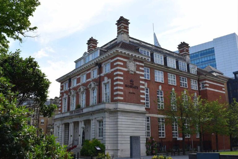 The hotel seen from the corner of Forbury Square, with its tall chimneys, dormer windows and ground-floor colonnade, The Roseate Reading
