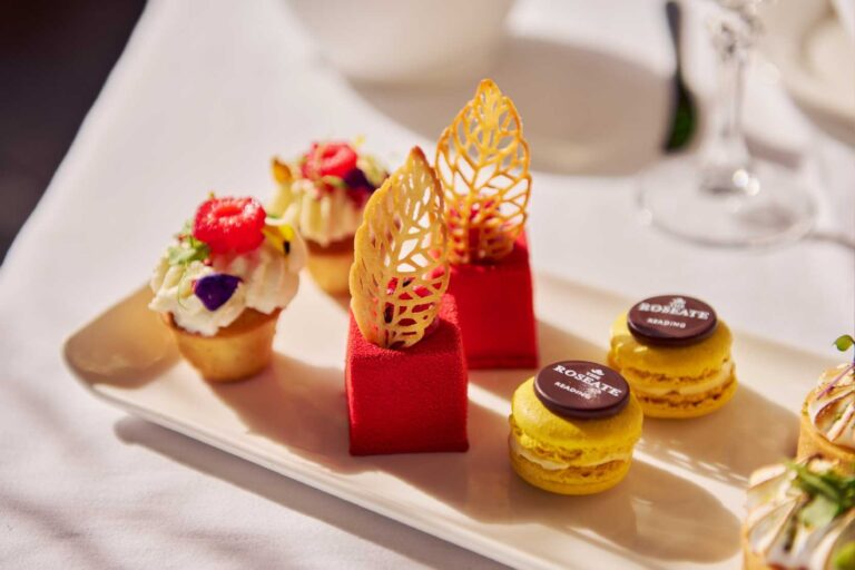 Afternoon tea pastries with macarons and gold-leaf chocolate, The Roseate Reading