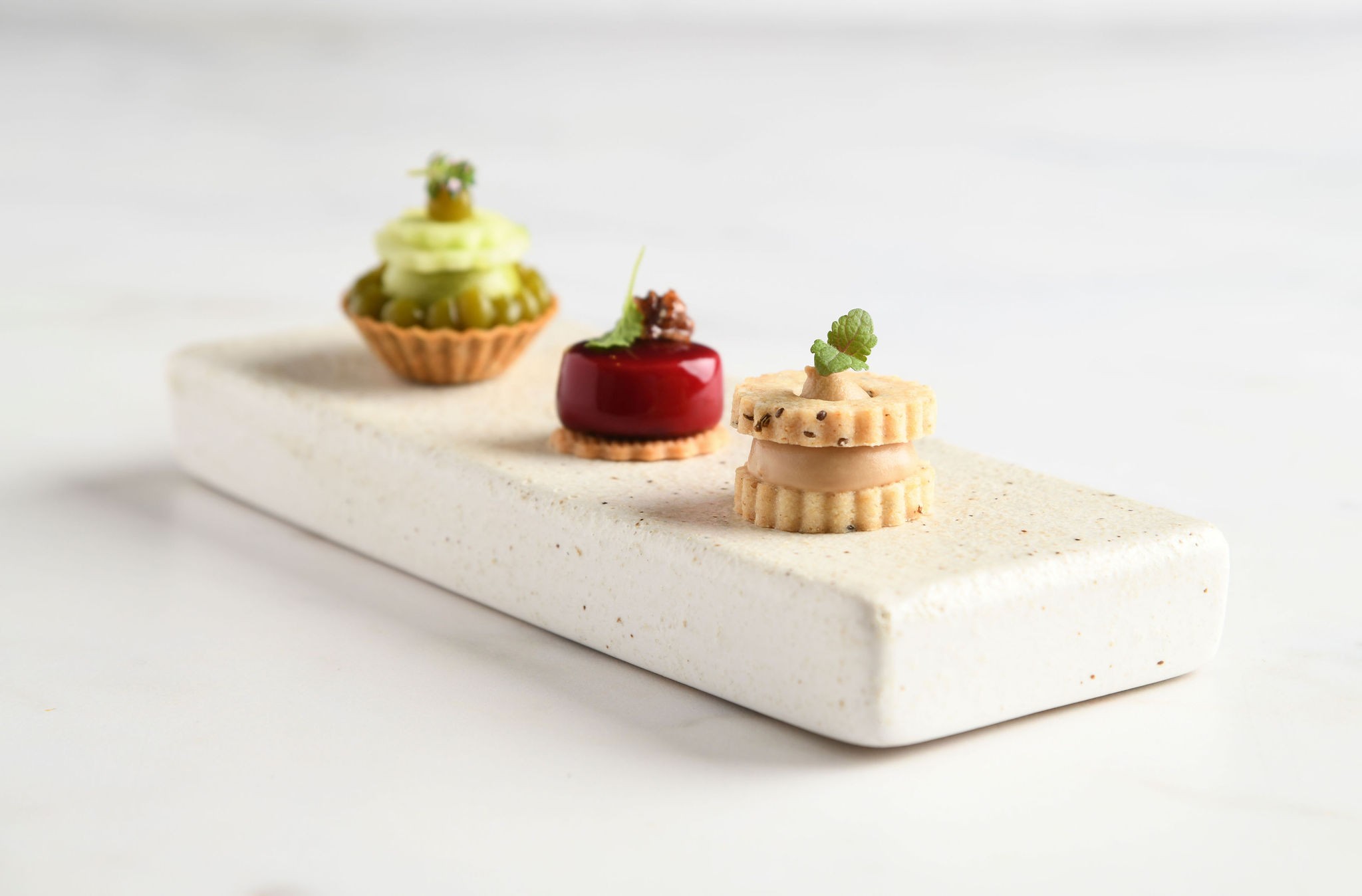Three small desserts on a slate, The Royal Crescent Hotel & Spa