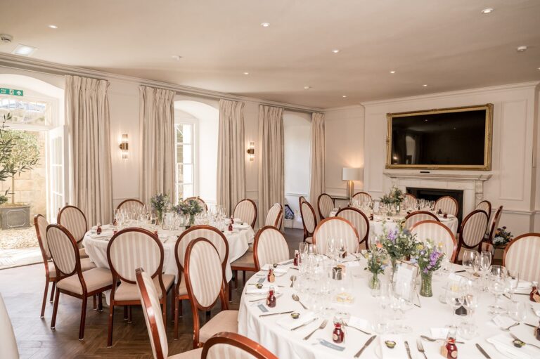 Round tables laid for a wedding breakfast in a drawing room, The Royal Crescent Hotel & Spa