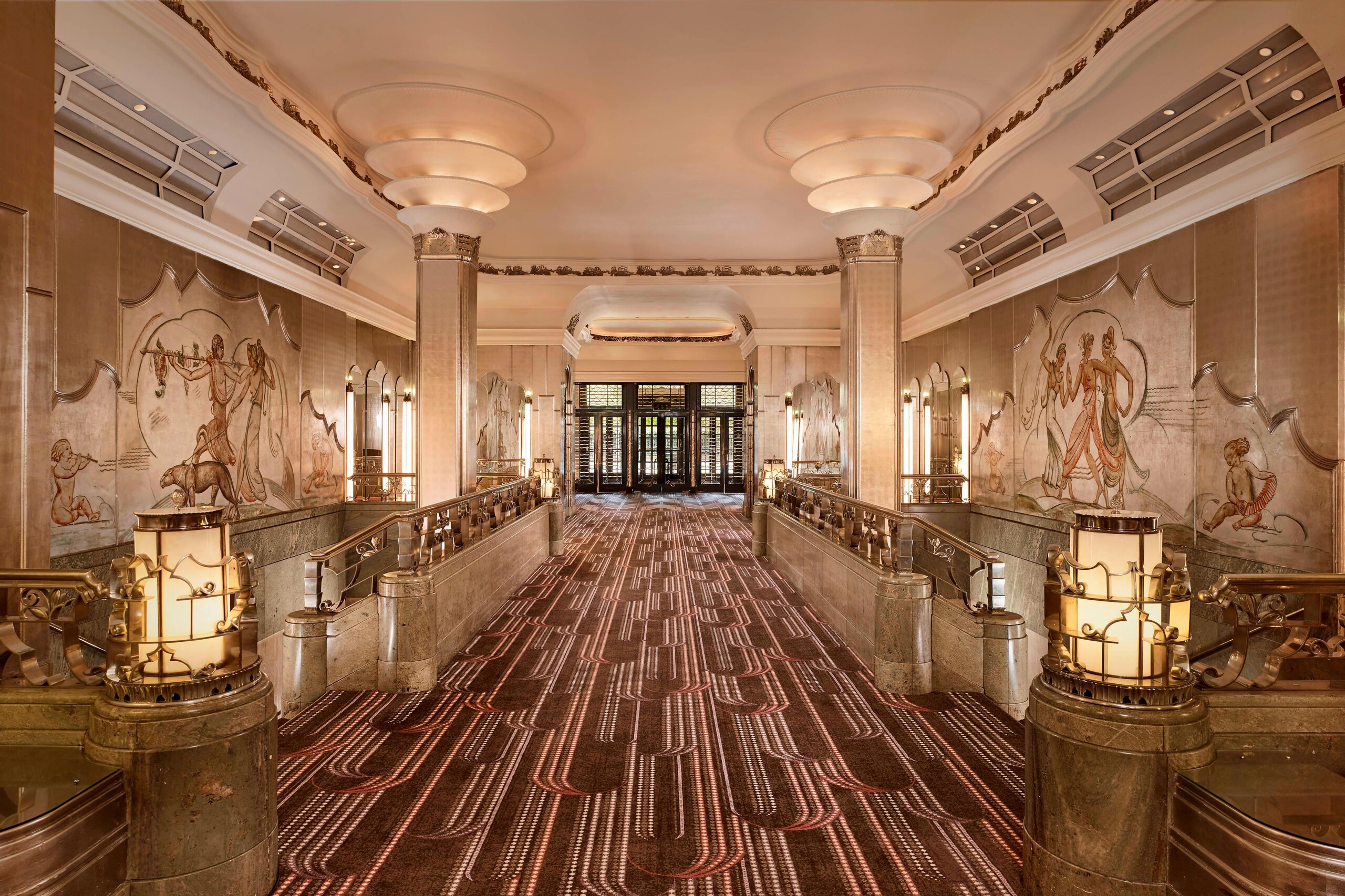 The Silver Gallery leading to the Ballroom, with painted murals, silvered columns and glowing lamps, The Sheraton Park Lane Hotel