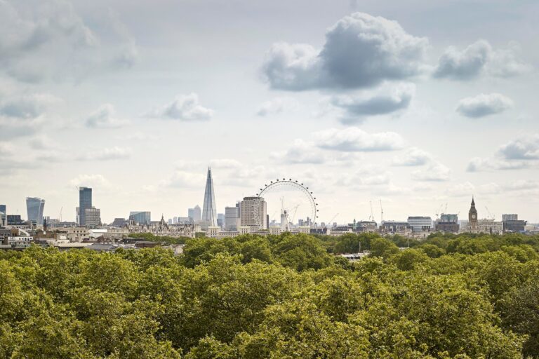 The view from the upper floors across Green Park to the London skyline, including the London Eye and the Shard, The Sheraton Park Lane Hotel