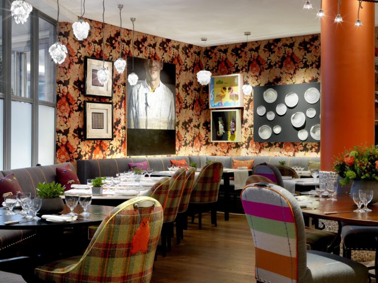 Dining at Refuel, beneath a patterned feature wall, The Soho Hotel