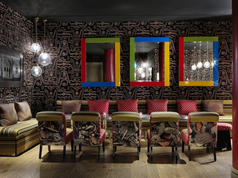 The Crimson Bar, with its patterned walls and bold colour, The Soho Hotel