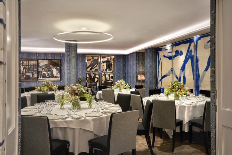 Round tables laid in the Indigo Room, The Soho Hotel