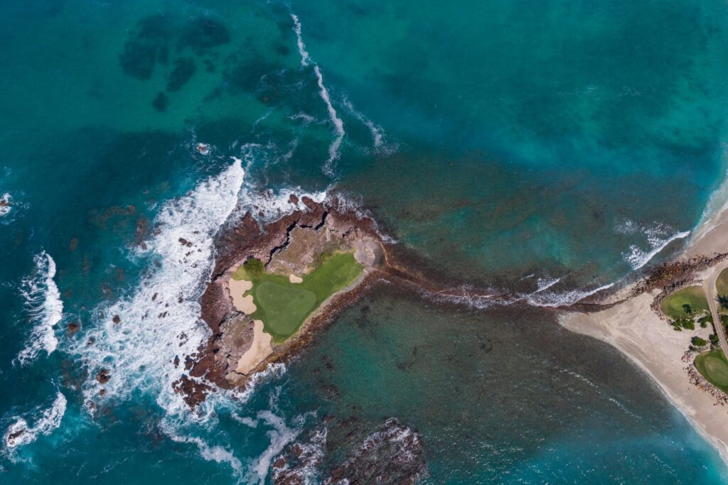 Aerial view of a golf hole on a rocky islet, The St. Regis Punta Mita Resort