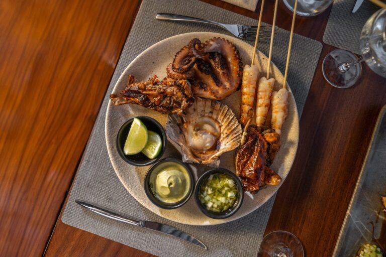 A grilled seafood platter with sauces, The St. Regis Punta Mita Resort
