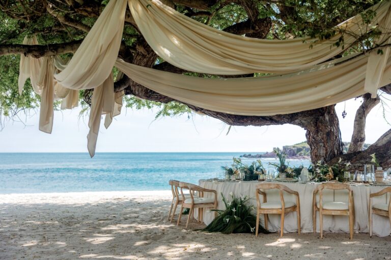 Draped fabric over a beach dinner table beneath a tree, The St. Regis Punta Mita Resort