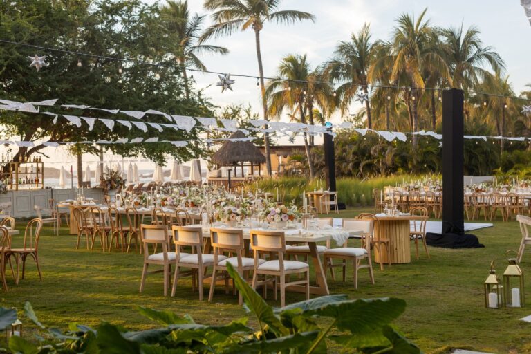 A lawn reception laid out under string lights, The St. Regis Punta Mita Resort