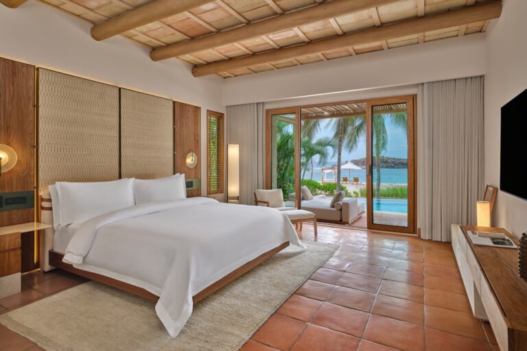 A villa bedroom with two beds and a view to the garden, The St. Regis Punta Mita Resort