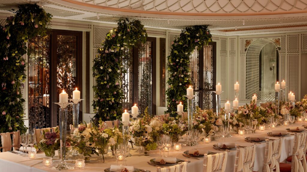 A long table dressed with greenery in the Canaletto Ballroom, The St. Regis Venice